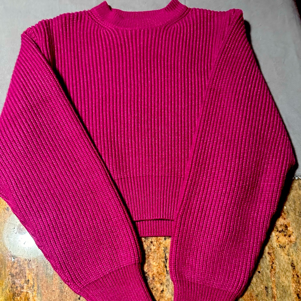 Matching sweater and skirt. Pink in color. Very well made. Brand new!!